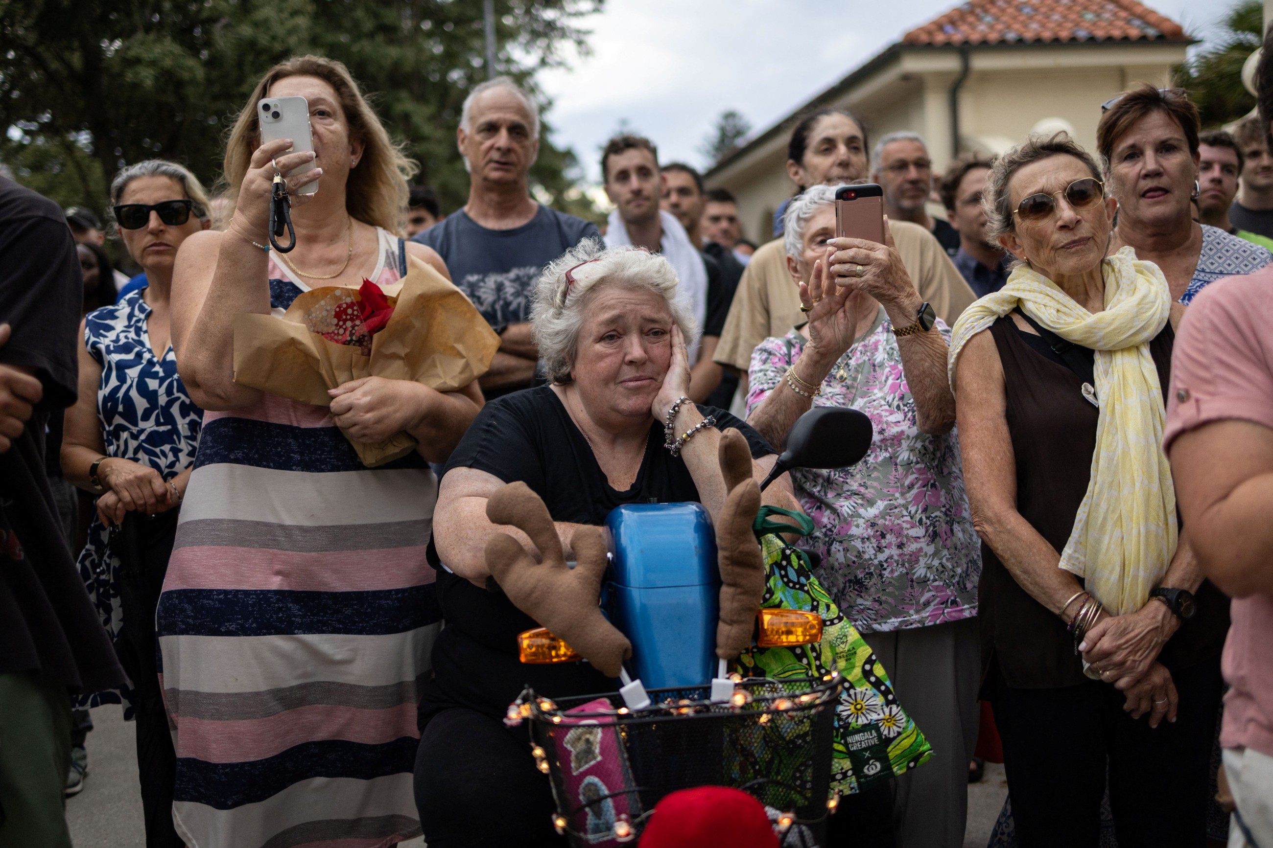 Australia announces gun buyback scheme as swimmers mourn Bondi shooting victims