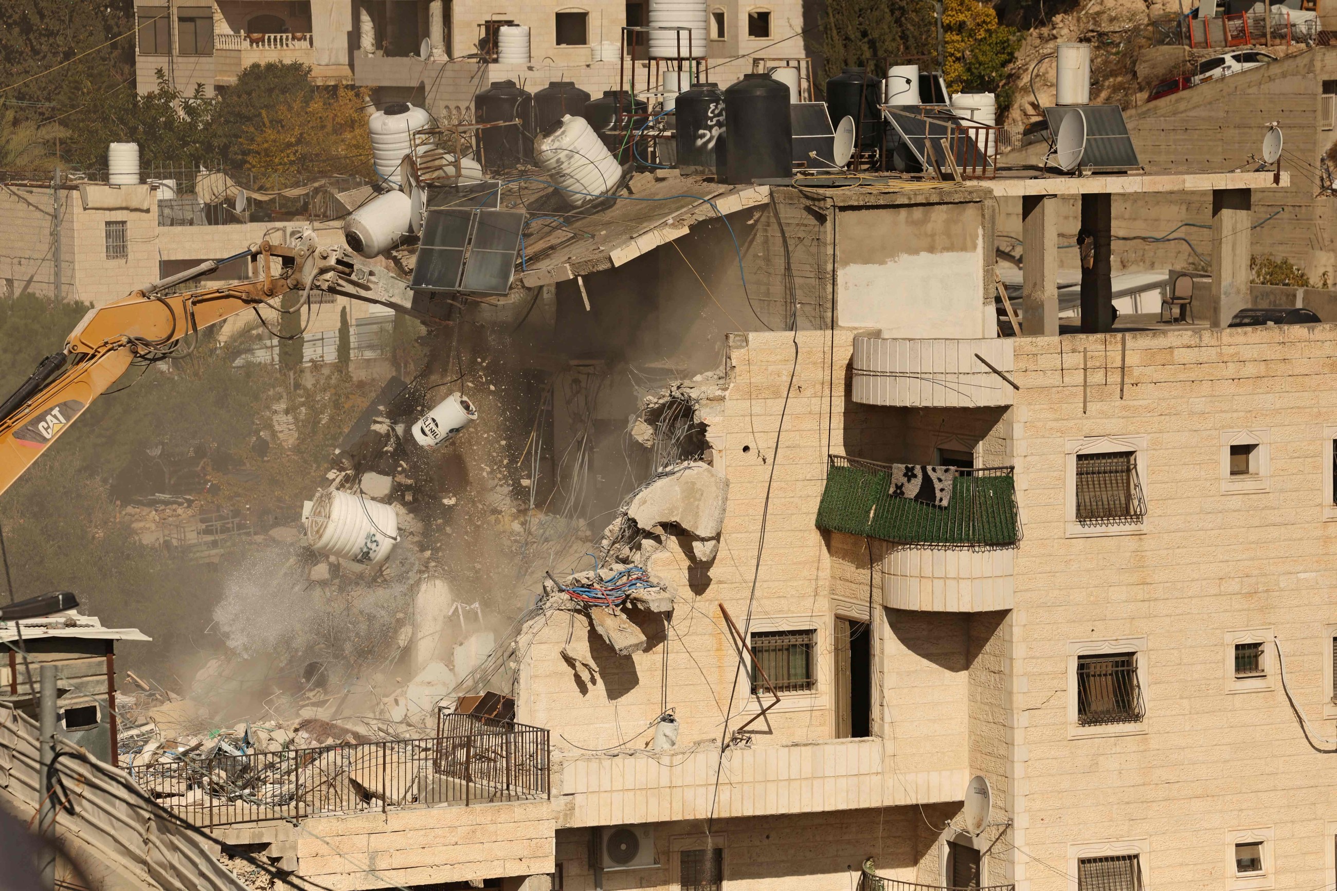 Israel demolishes east Jerusalem building, evicting Palestinians