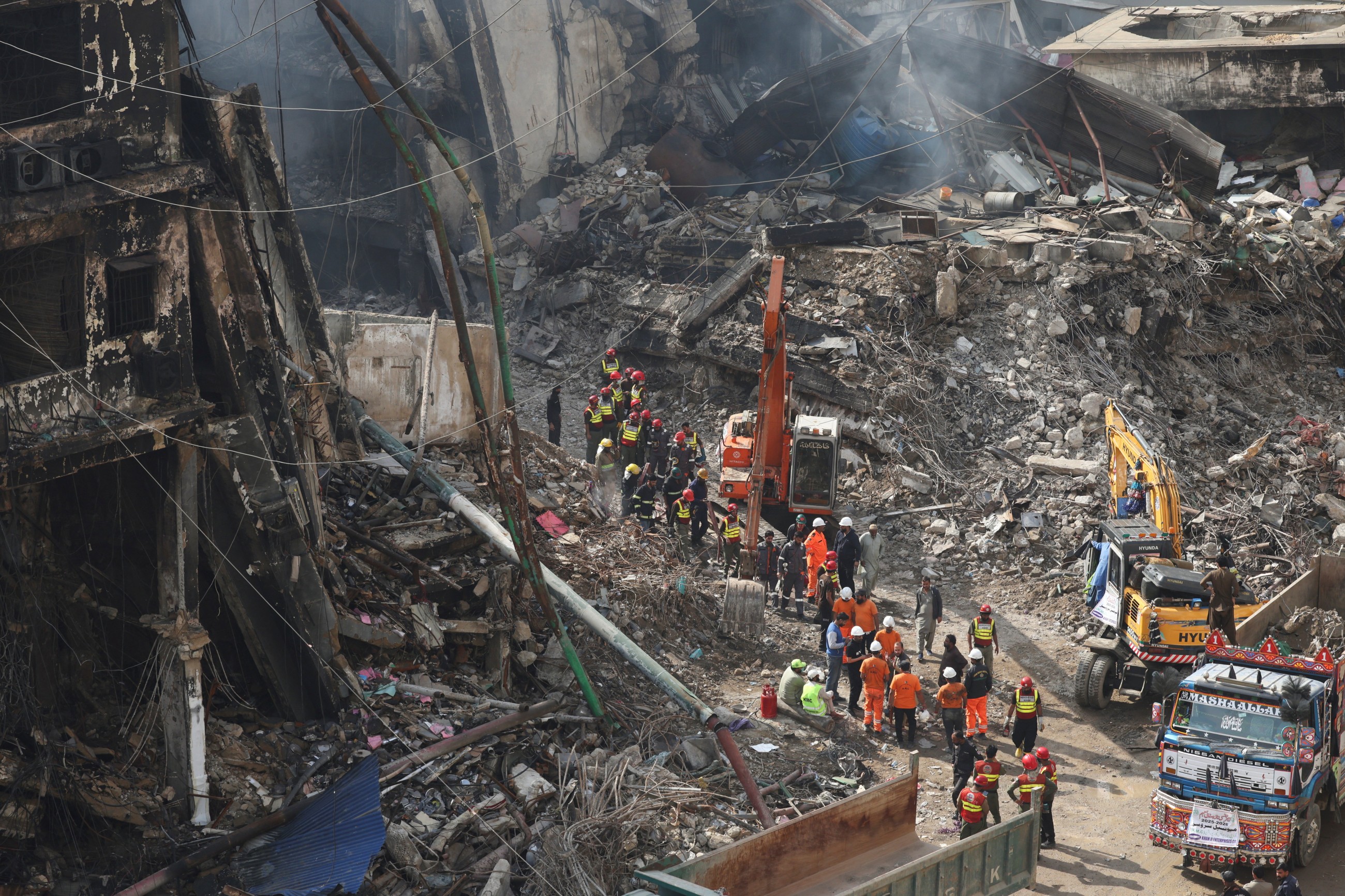 Dozens of body parts are found after shopping plaza fire in Pakistani city of Karachi