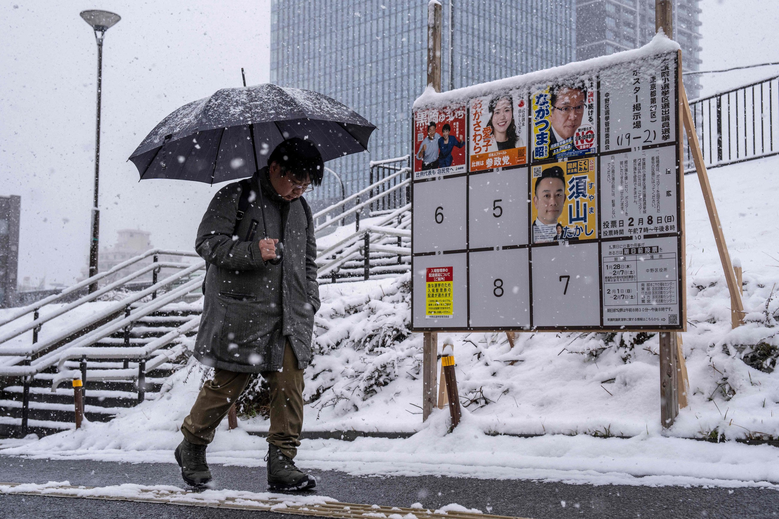 Japan votes in snow-hit snap polls as Takaichi eyes strong mandate