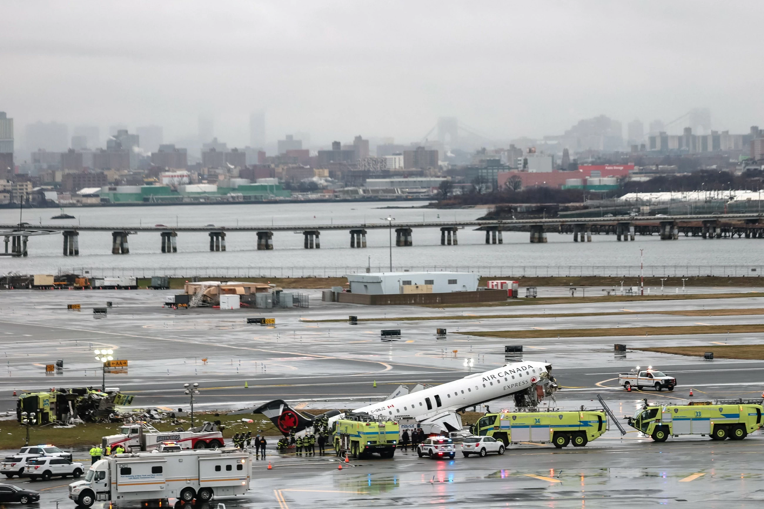 Two pilots dead after passenger jet crashes into fire truck at LaGuardia Airport in New York