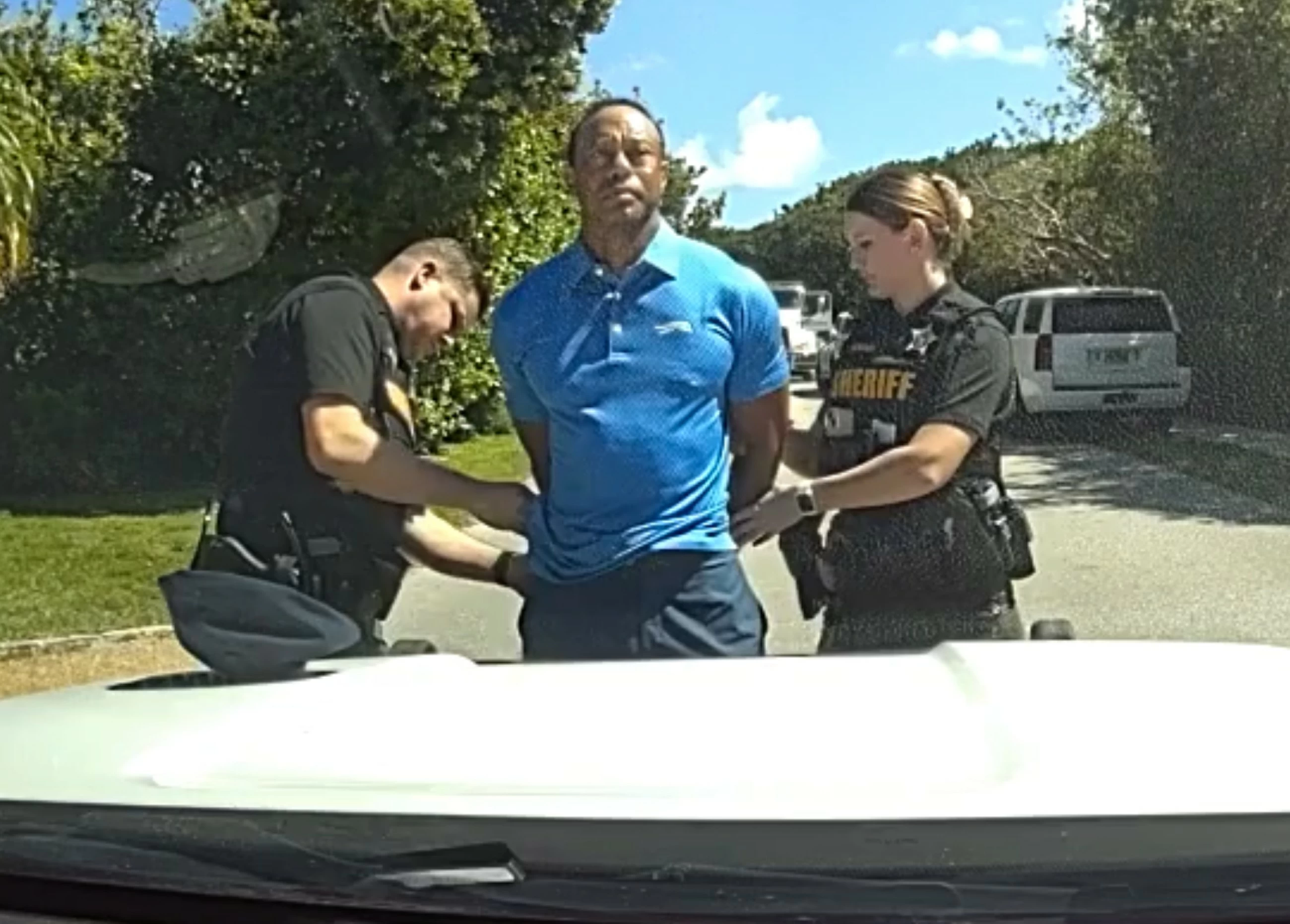 Stunned Tiger Woods handcuffed after Florida rollover crash, bodycam shows