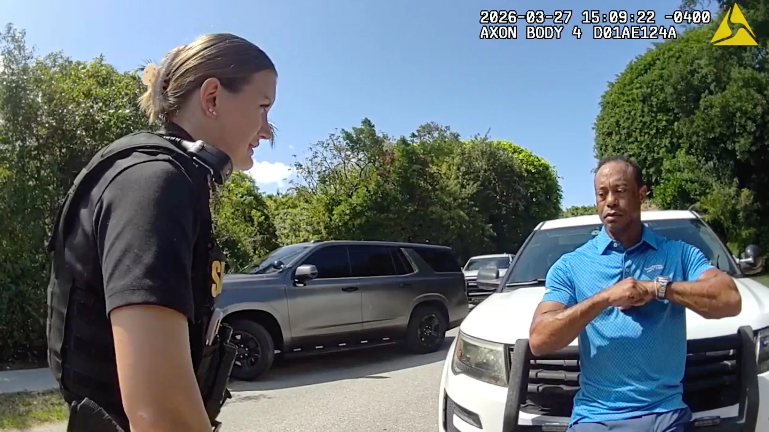 Stunned Tiger Woods handcuffed after Florida rollover crash, bodycam shows