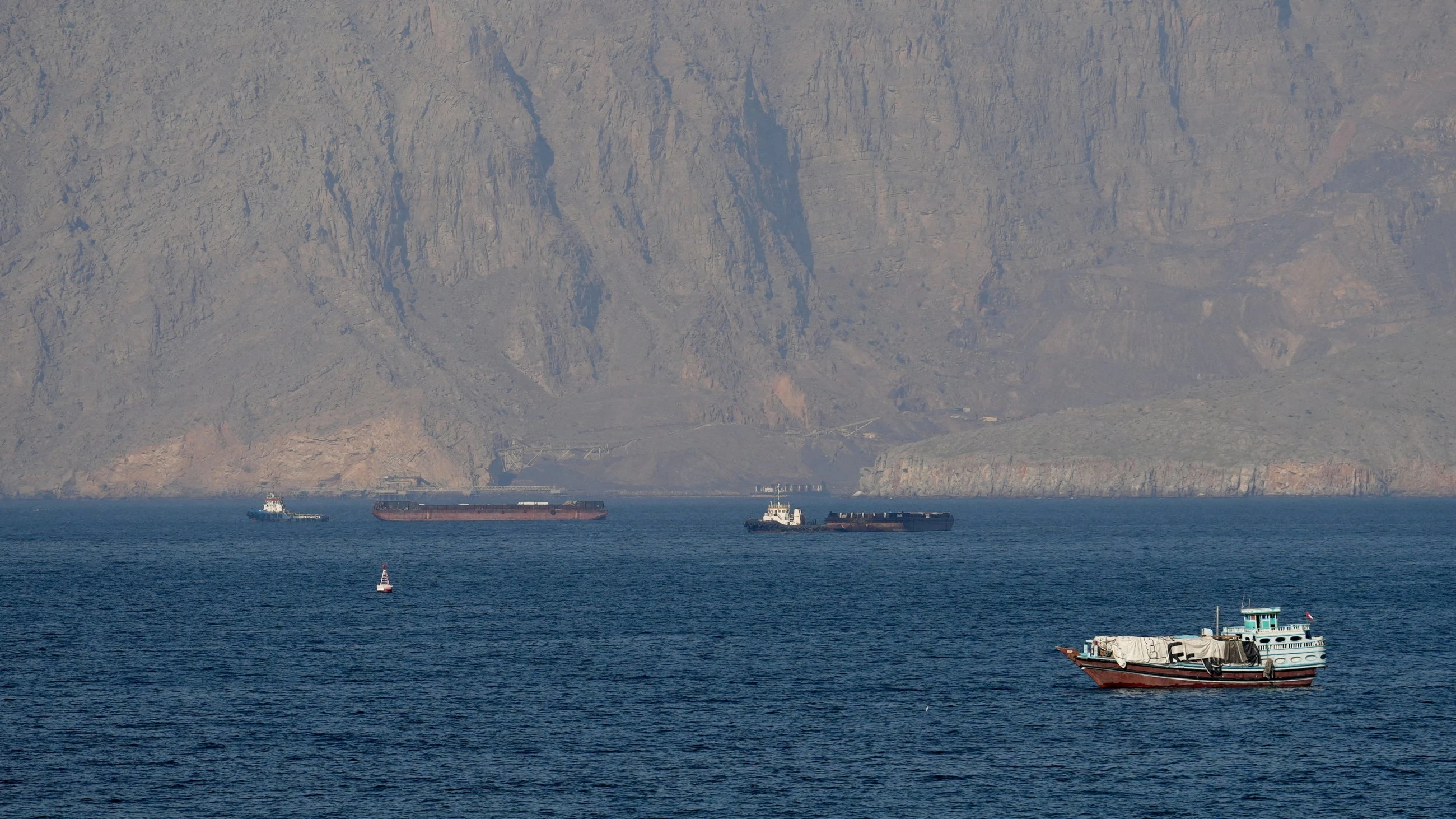Iran warns of ceasefire violation as US plans to escort Hormuz ships