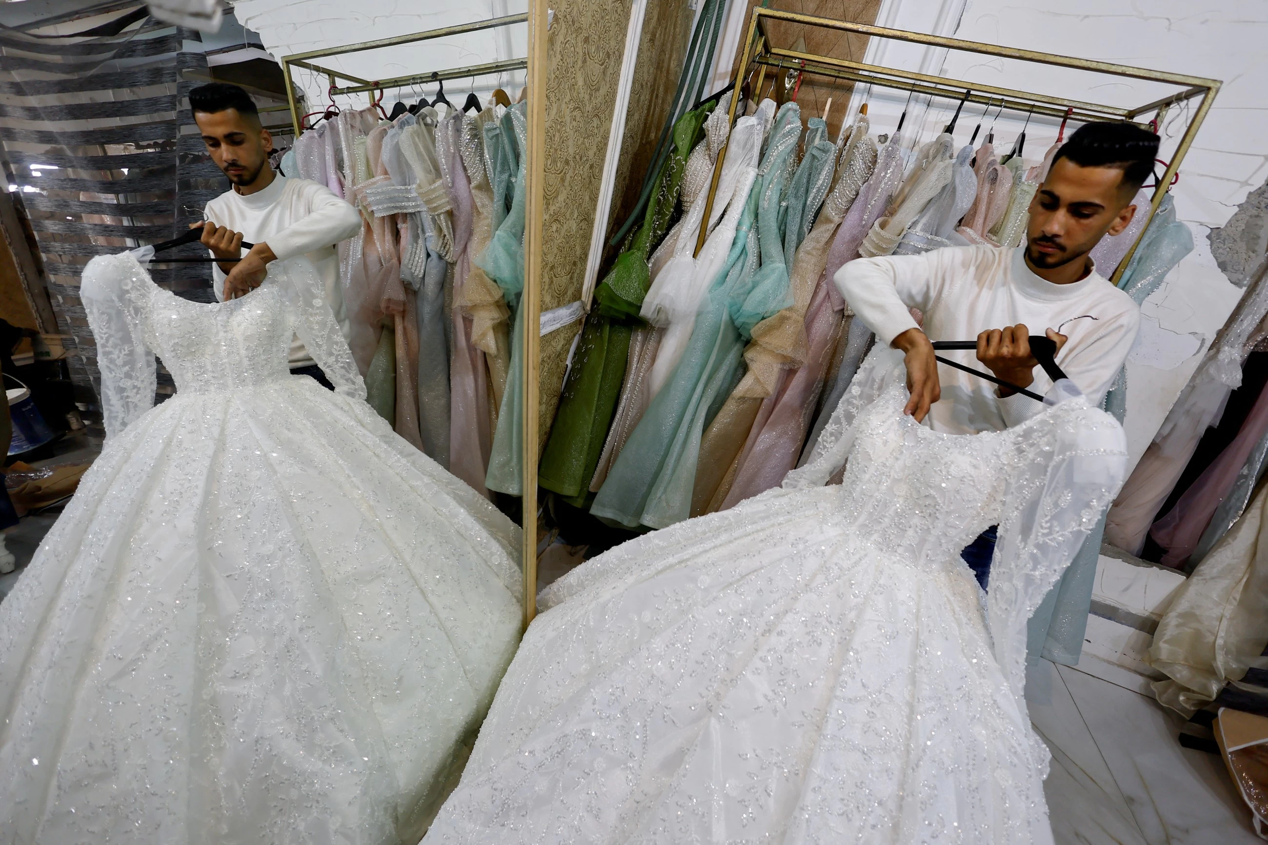 In war‑scarred Gaza, brides turn to refurbished wedding dresses