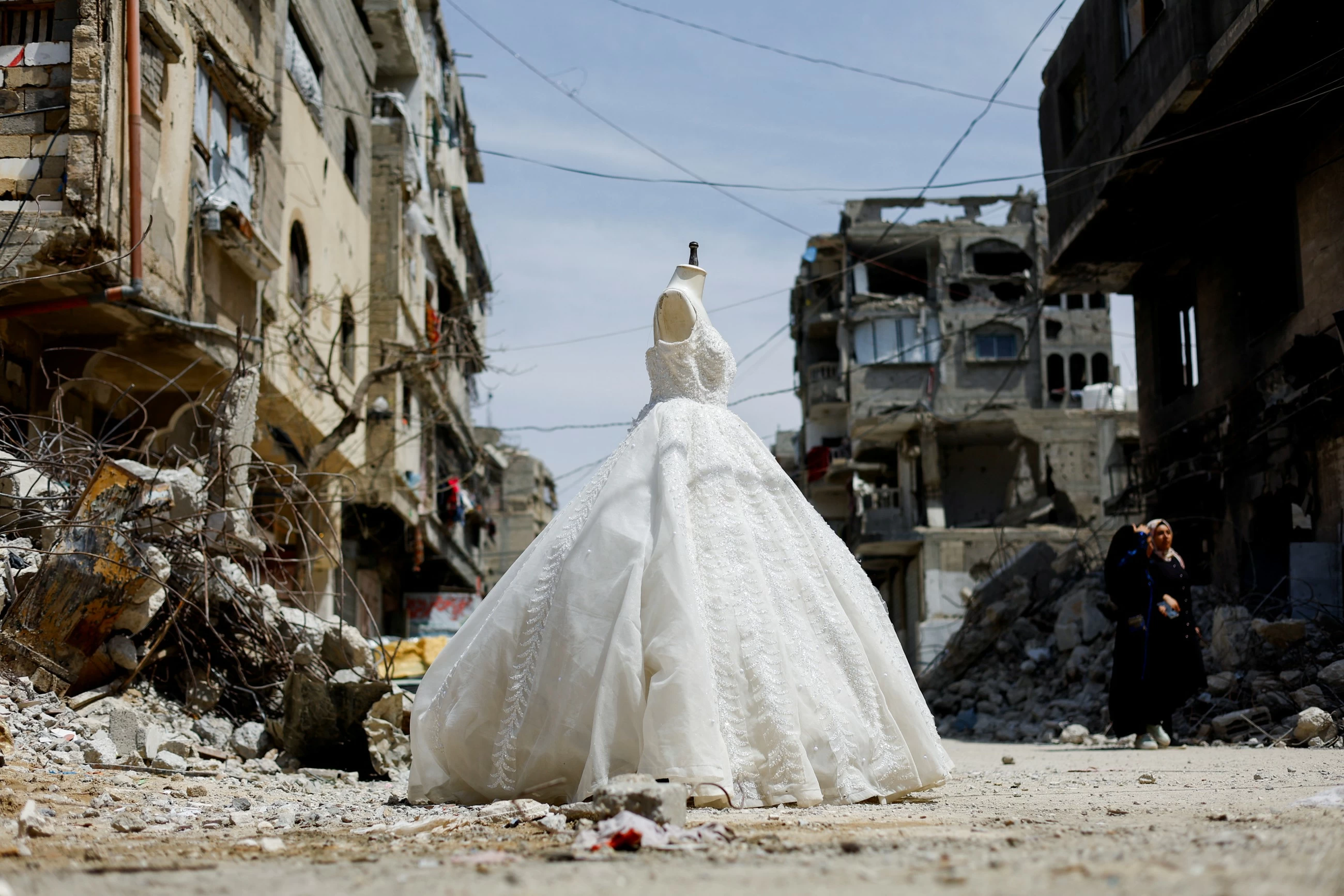 In war‑scarred Gaza, brides turn to refurbished wedding dresses