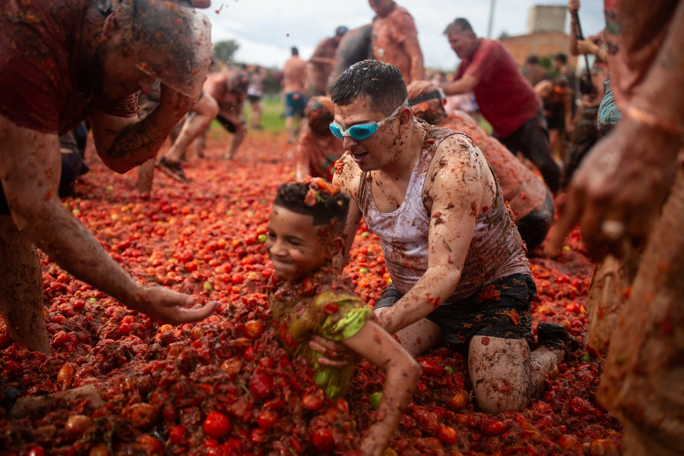 Thousands of revellers pelt each other with tomatoes at annual Tomatina festival in Colombia