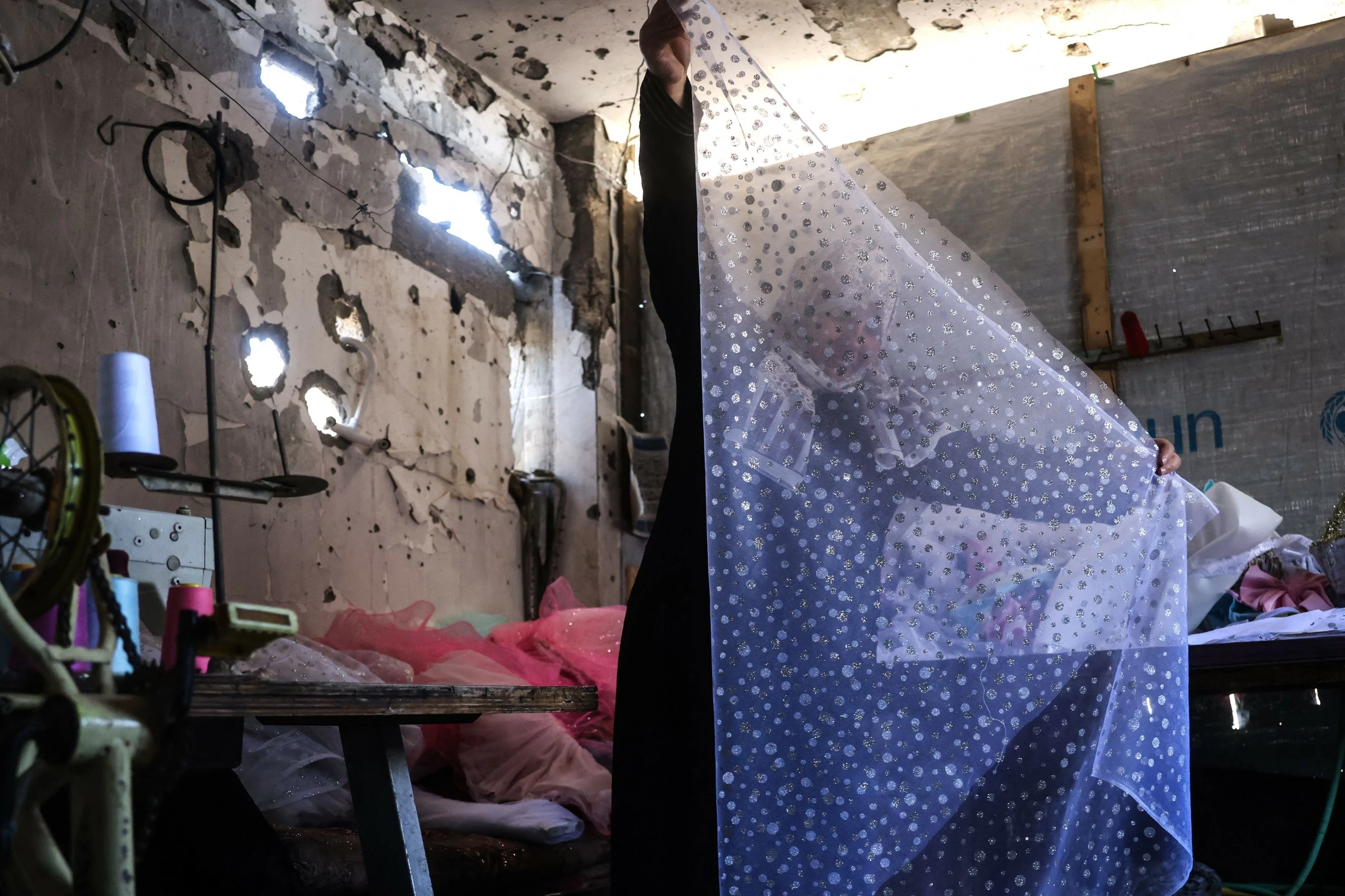 Gaza tailor turns waste fabrics into dresses for girls
