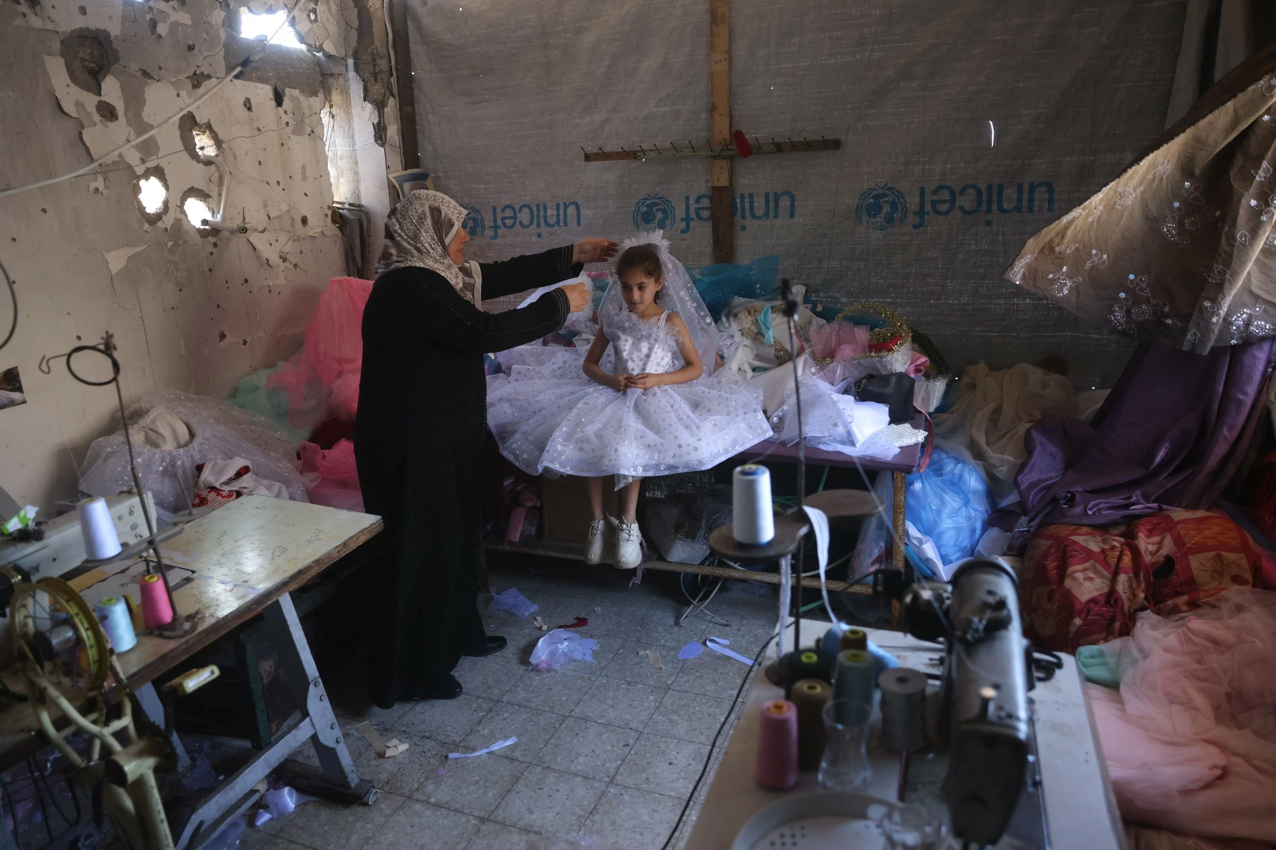 Gaza tailor turns waste fabrics into dresses for girls