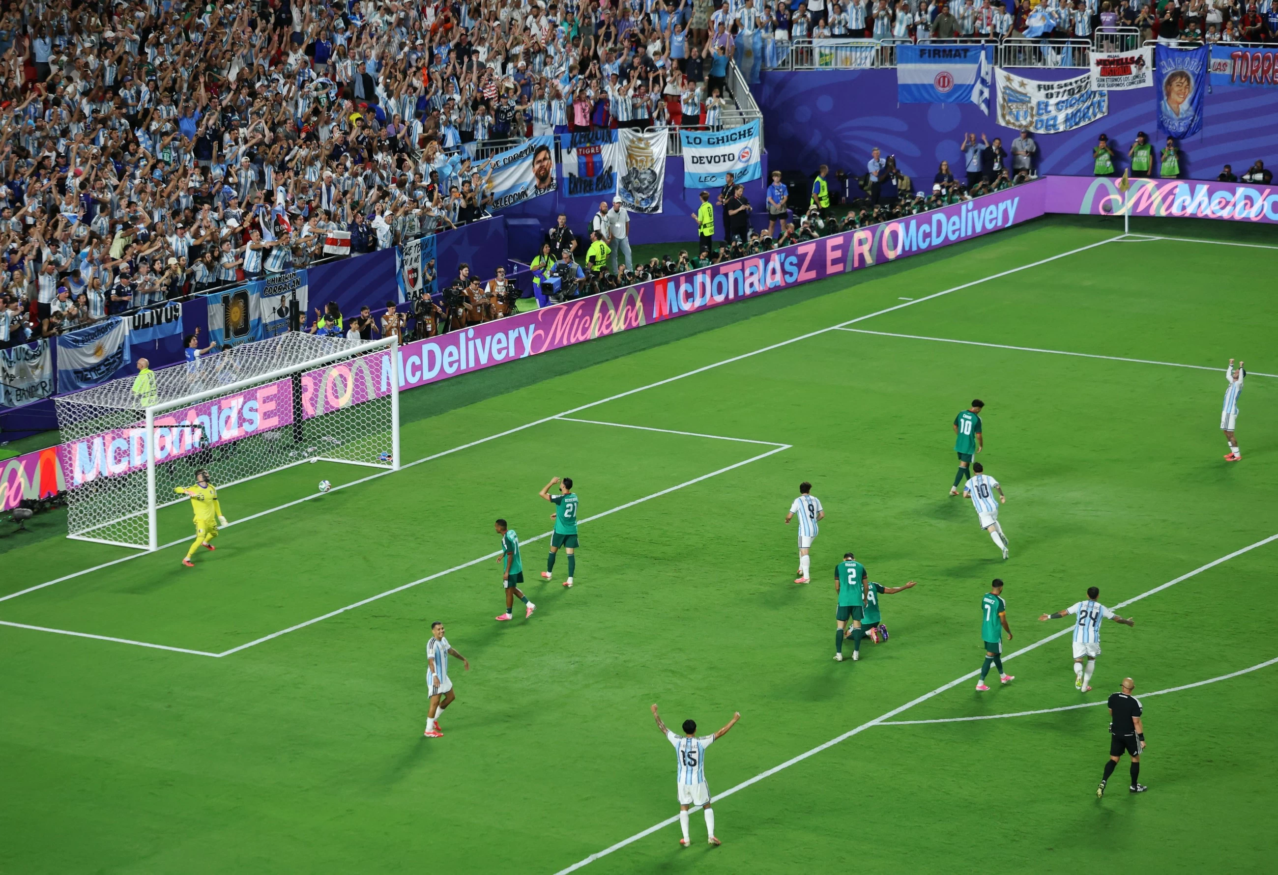 Lionel Messi ties men's World Cup goals record with a hat trick as Argentina tops Algeria