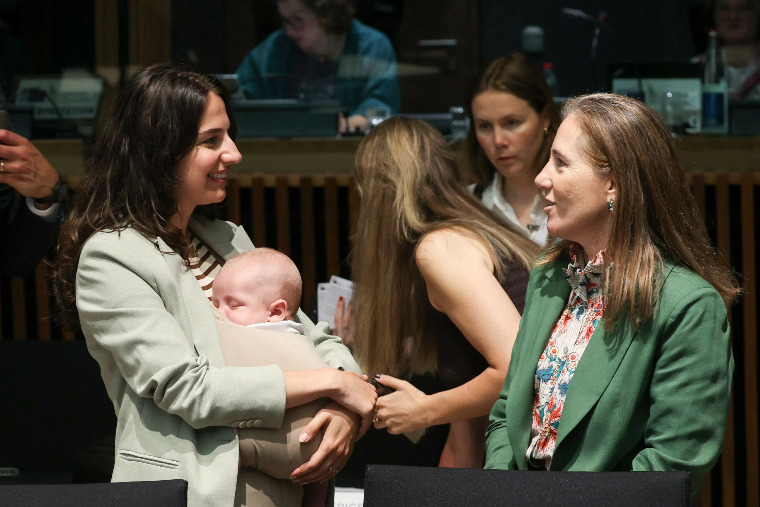 Swedish minister breaks ground bringing baby to EU talks