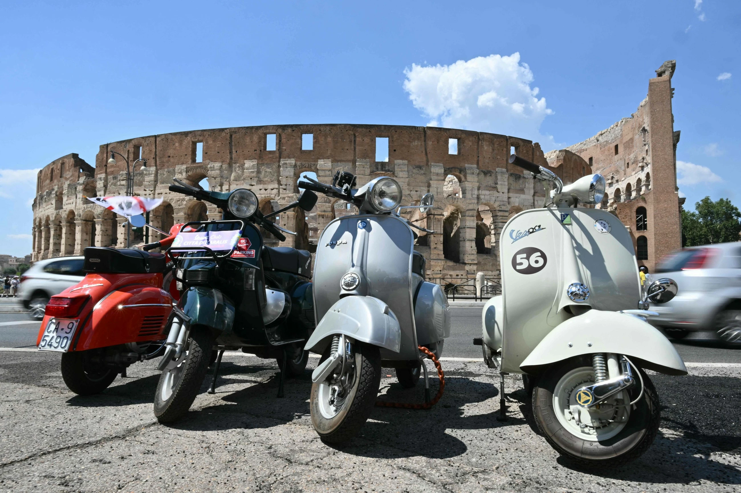 Thousands ride through Rome as Italy’s iconic scooter Vespa turns 80