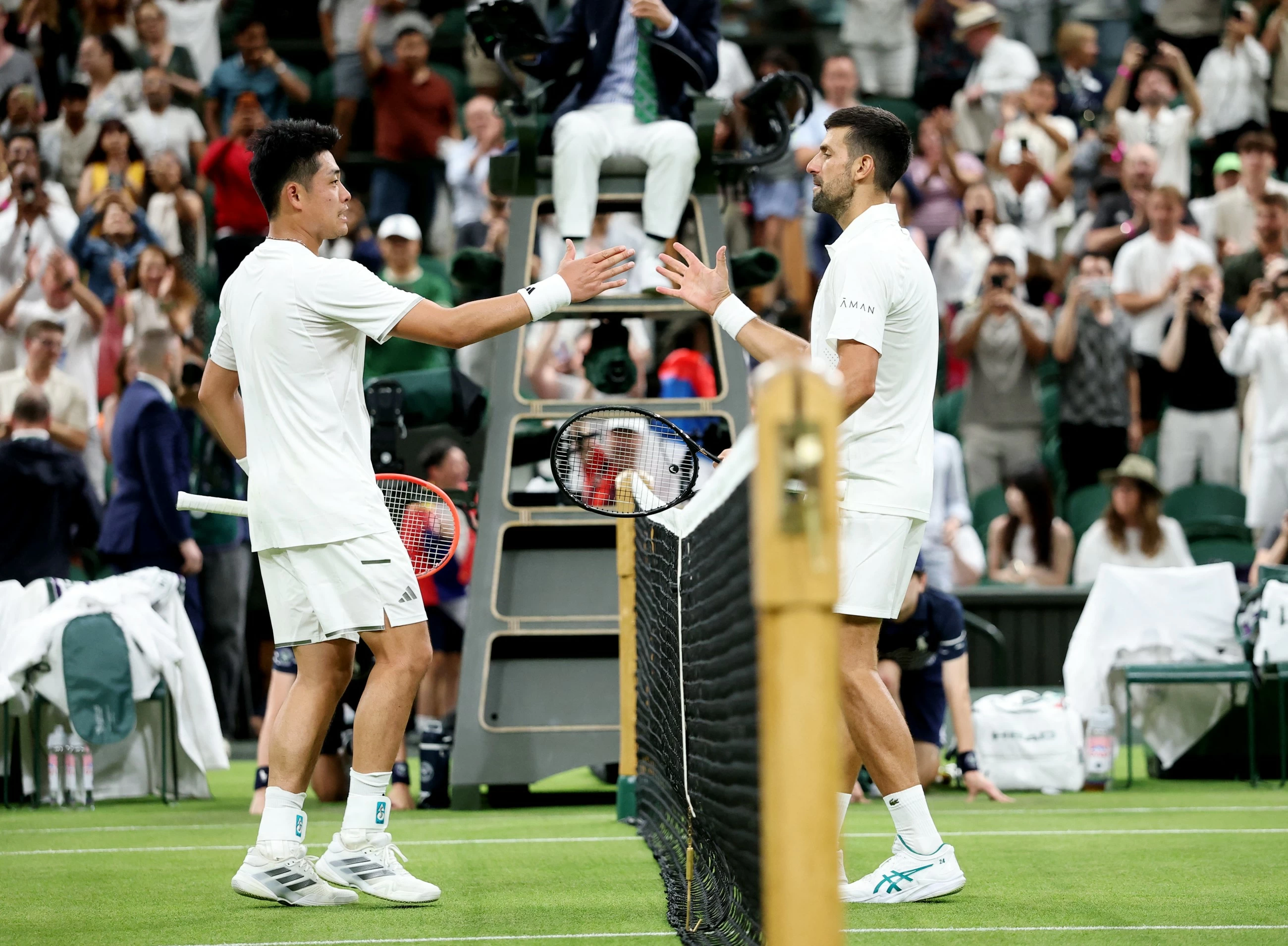 Djokovic battles past Wu in 'challenging' Wimbledon first round