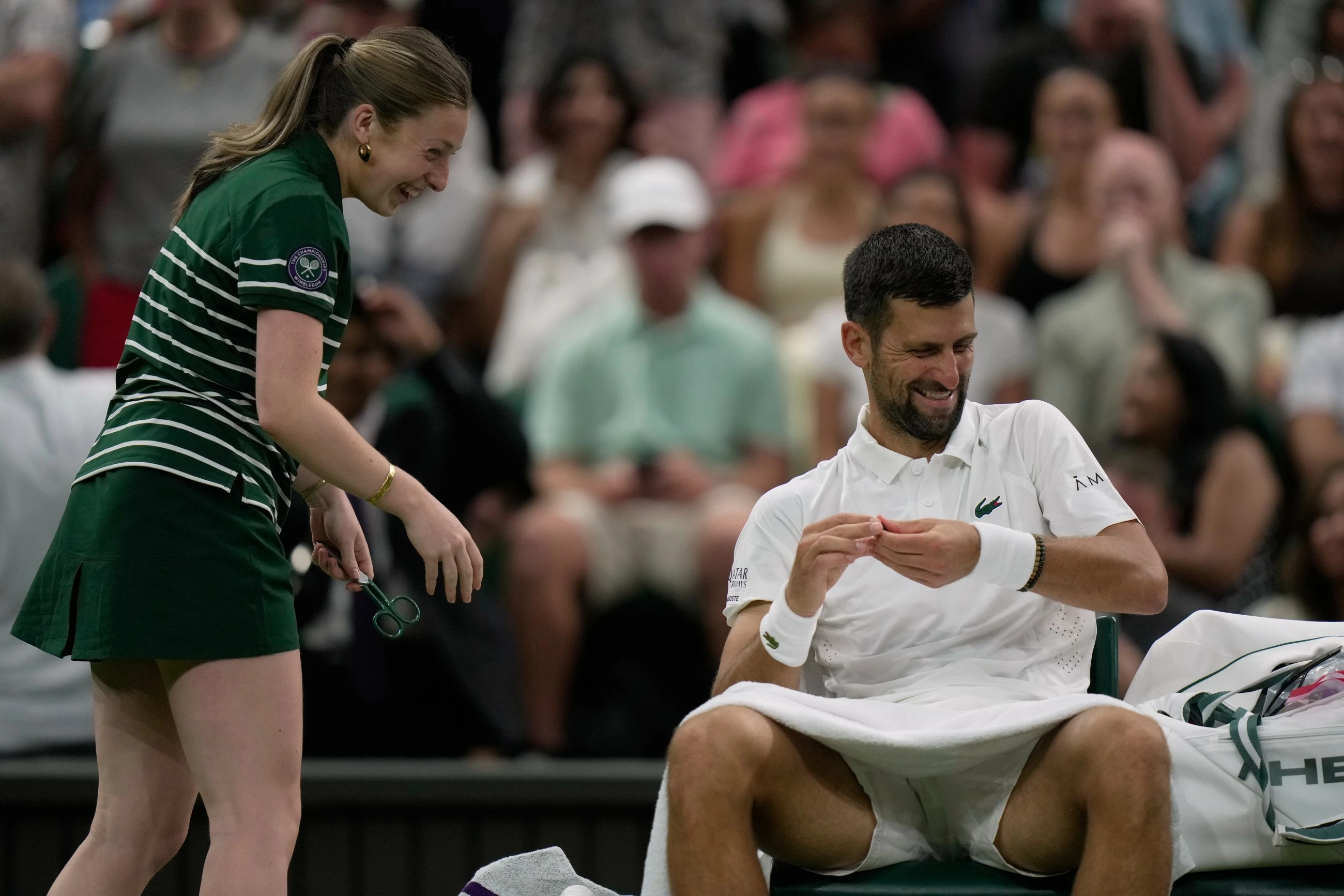 Djokovic scares ball girl, then eyes McIlroy's Green Jacket