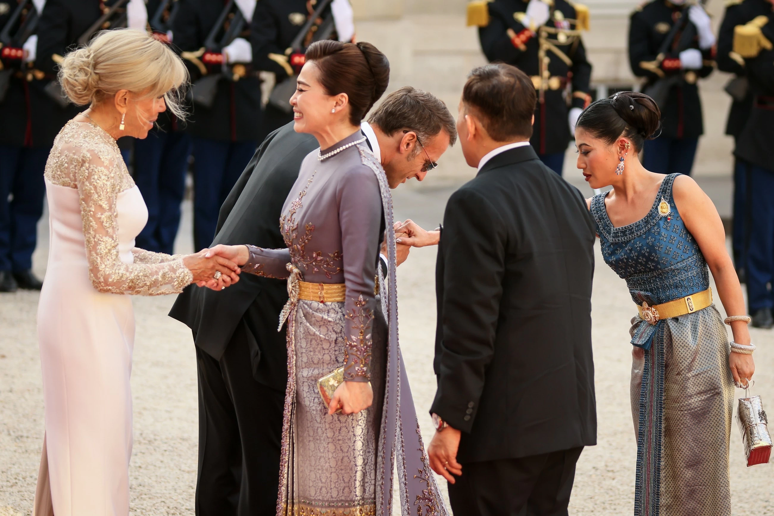 Thailand denies viral claim French President Macron knelt before king