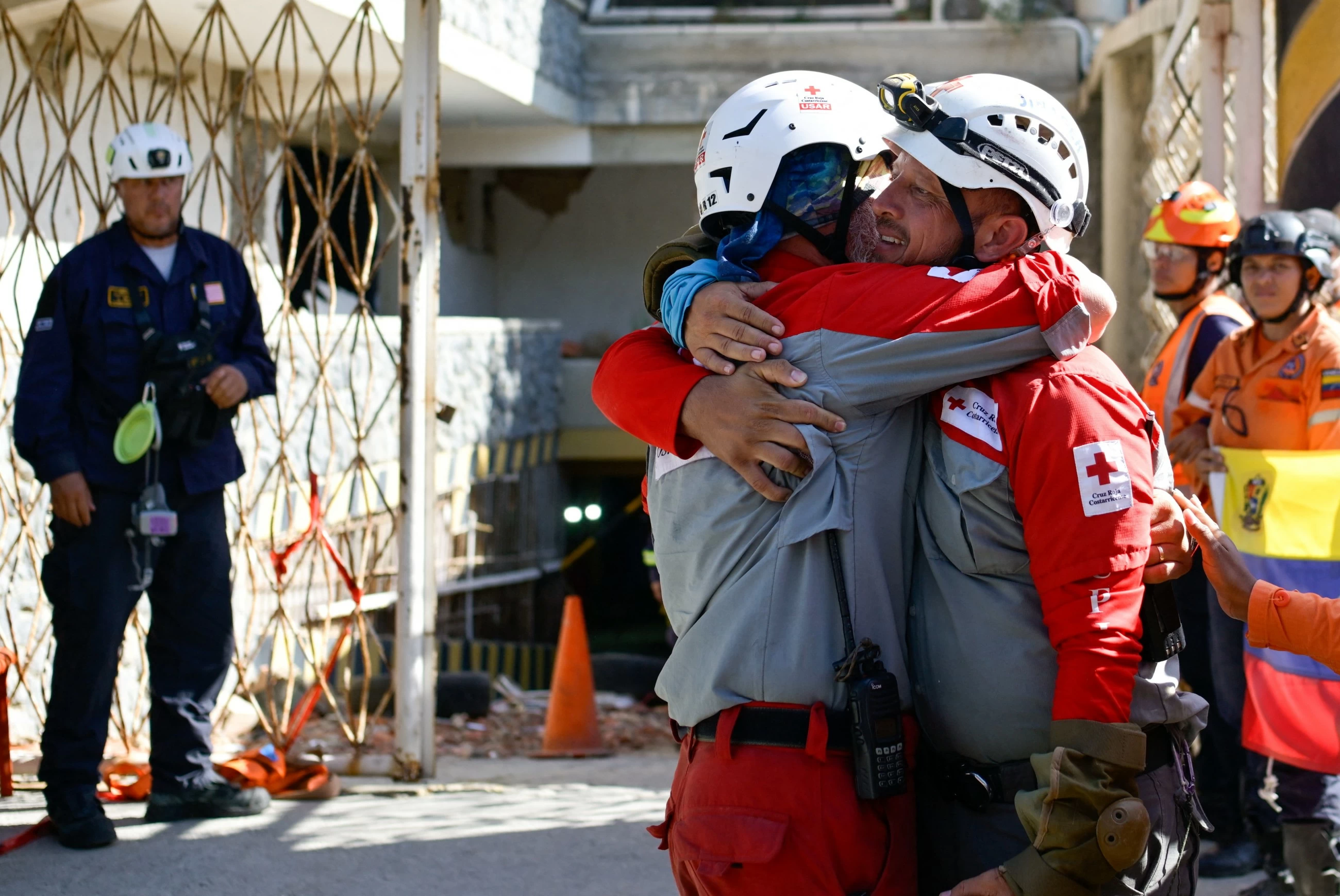Rescuers dig out Venezuelan security guard 8 days after quakes; death toll nears 2,300