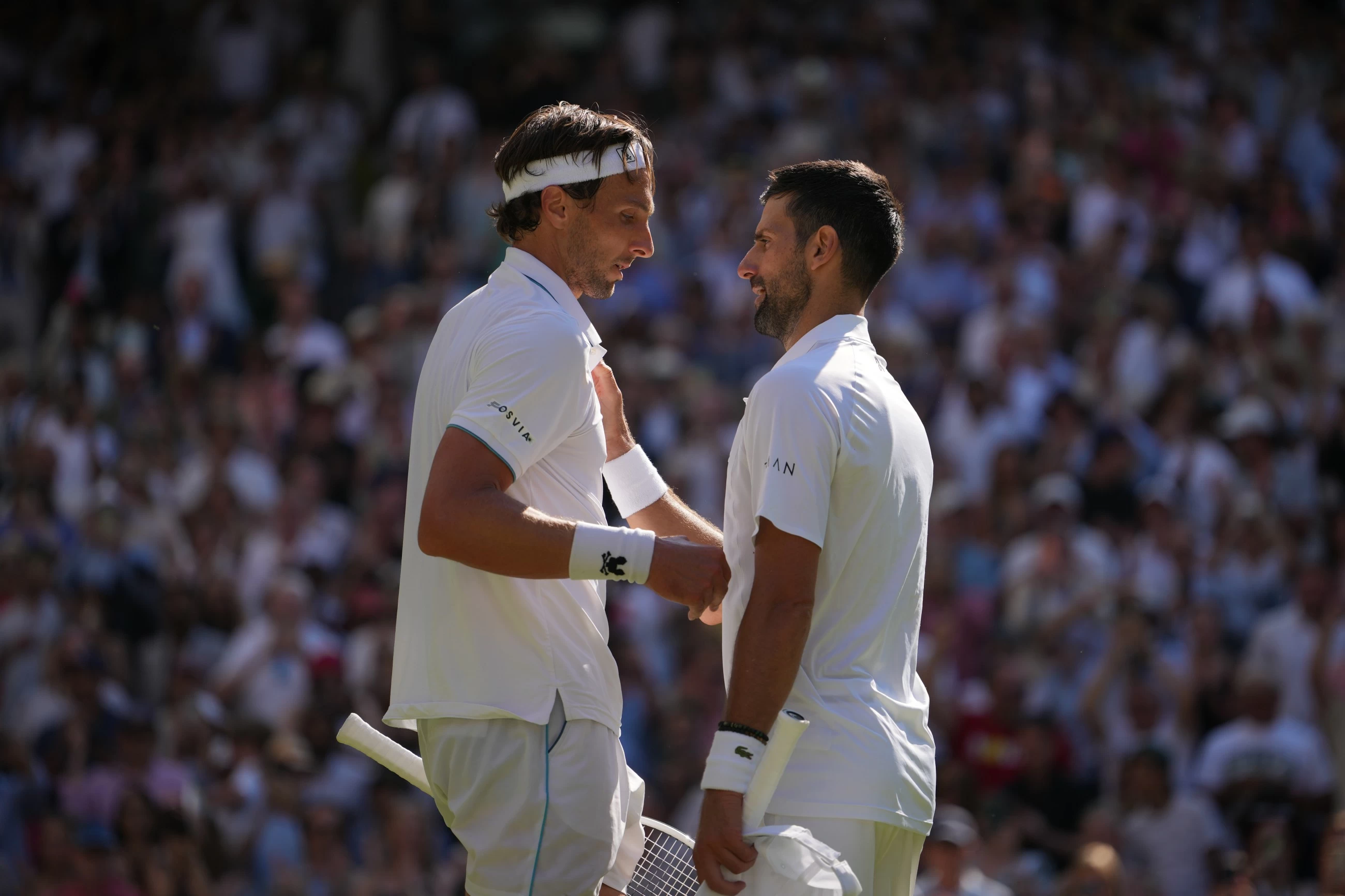 Title rivals Djokovic, Sinner advance at Wimbledon