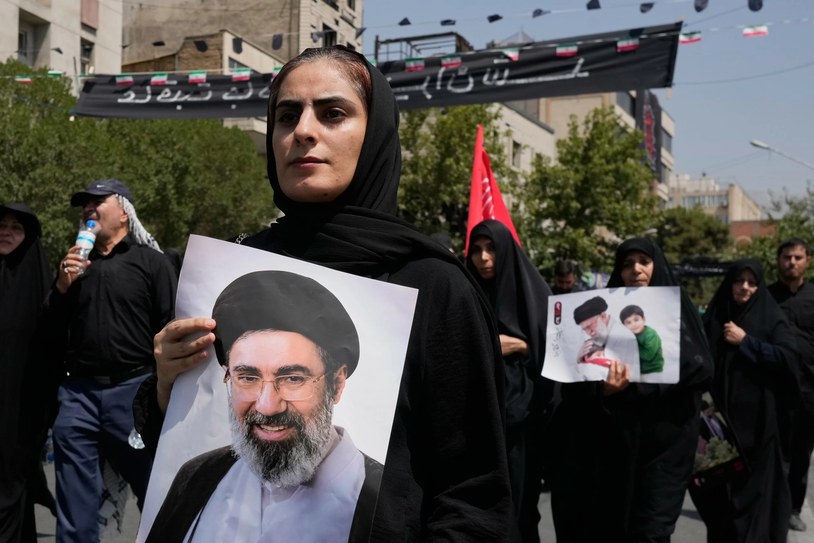 Three sons of Iran's slain leader Khamenei appear at funeral, not his successor