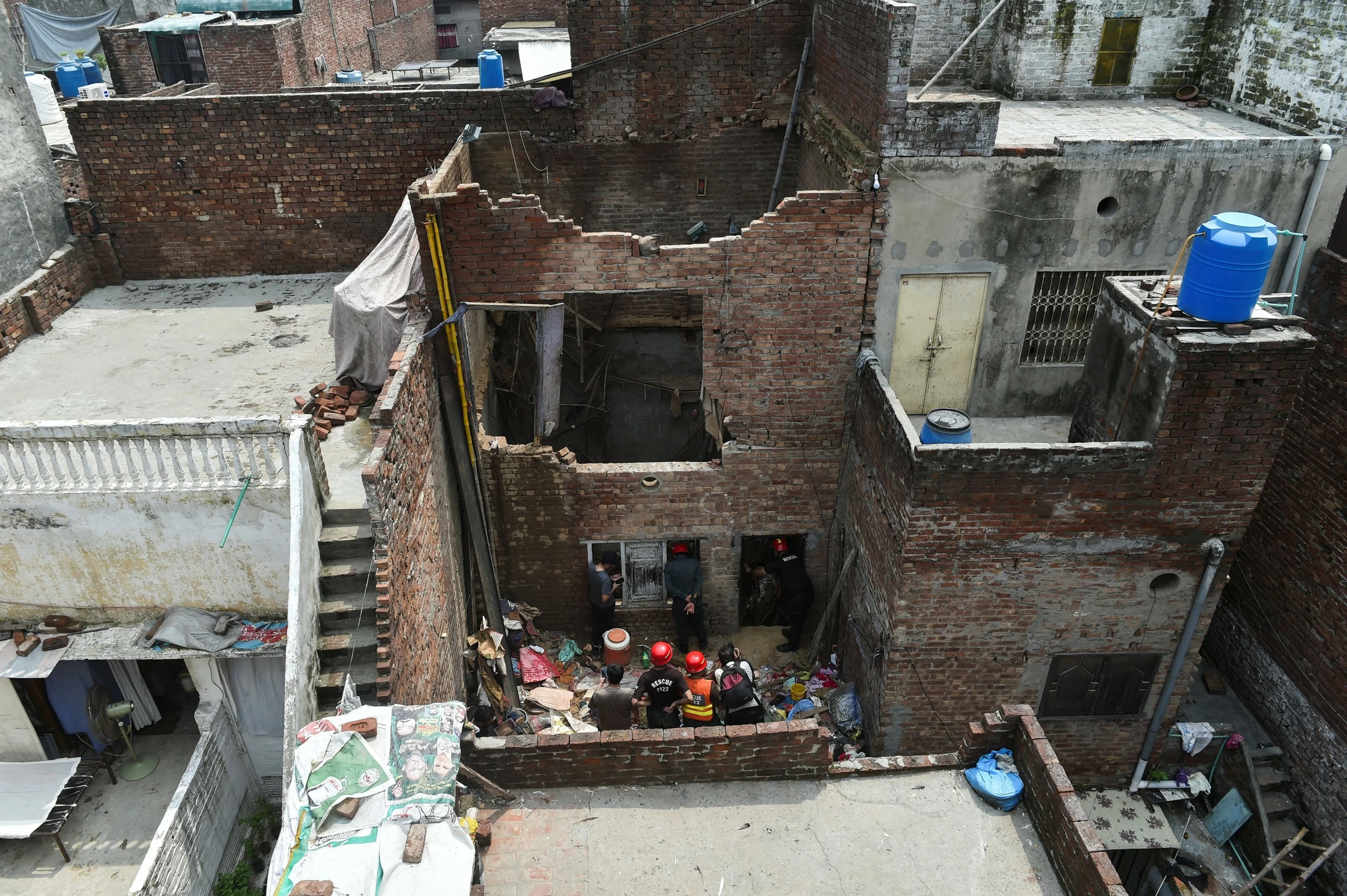 Monsoon rain triggers house collapse in Pakistan's Lahore city, killing 9 family members