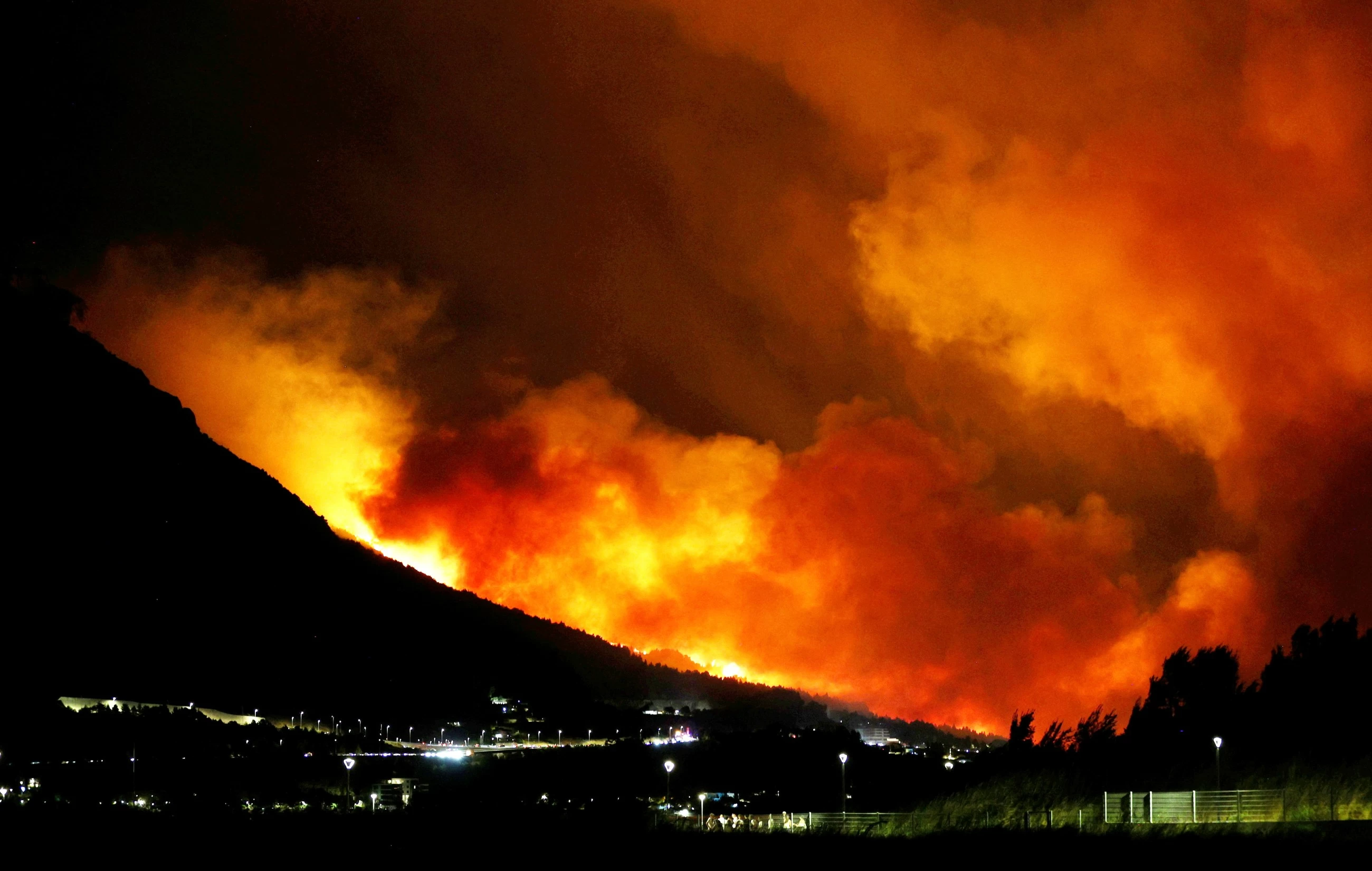 Tourists flee as Greek wildfire hits resort; Croatia also fights blaze