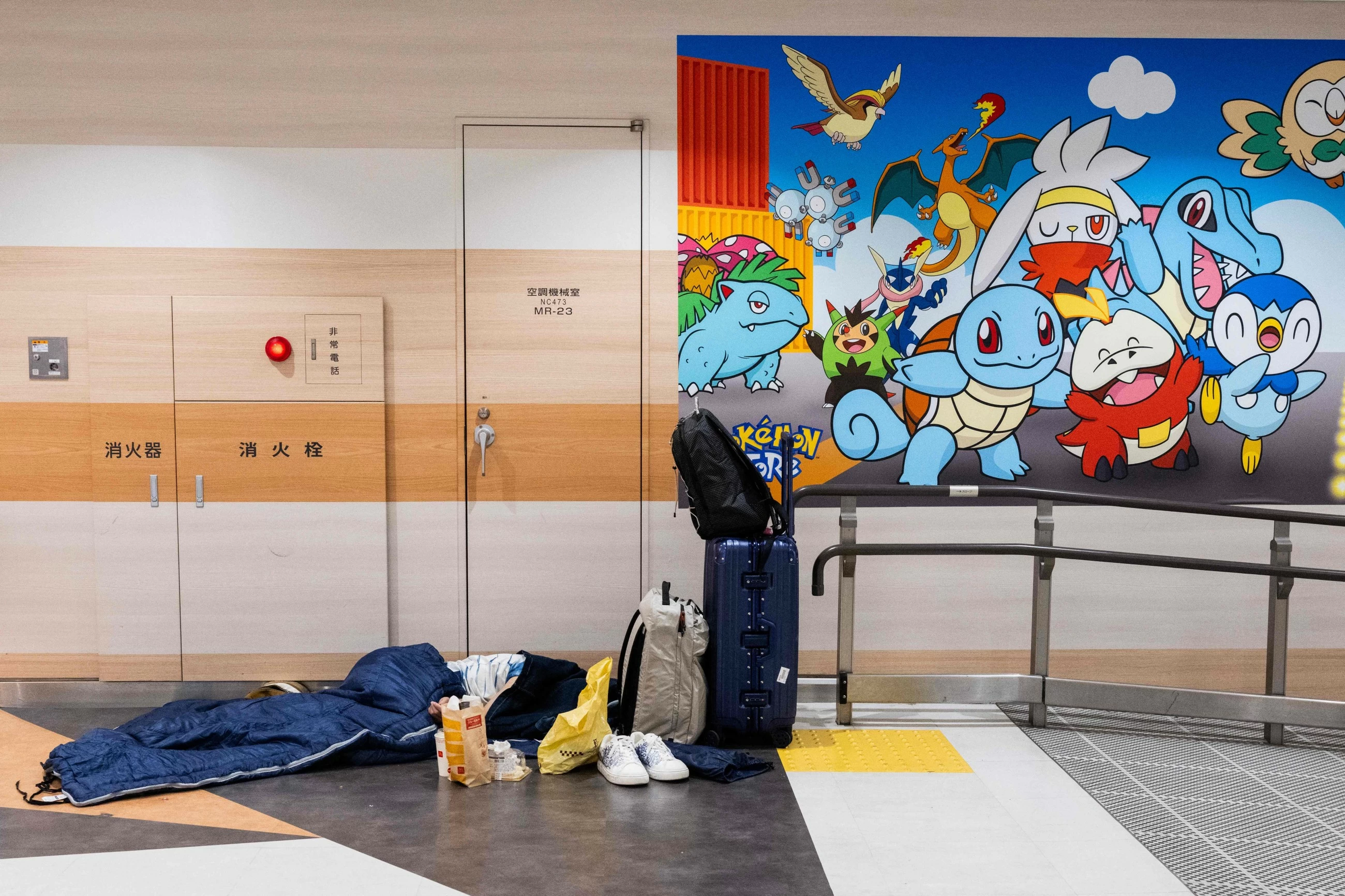 Thousands stranded at Japan's Narita airport as record rain hits transport