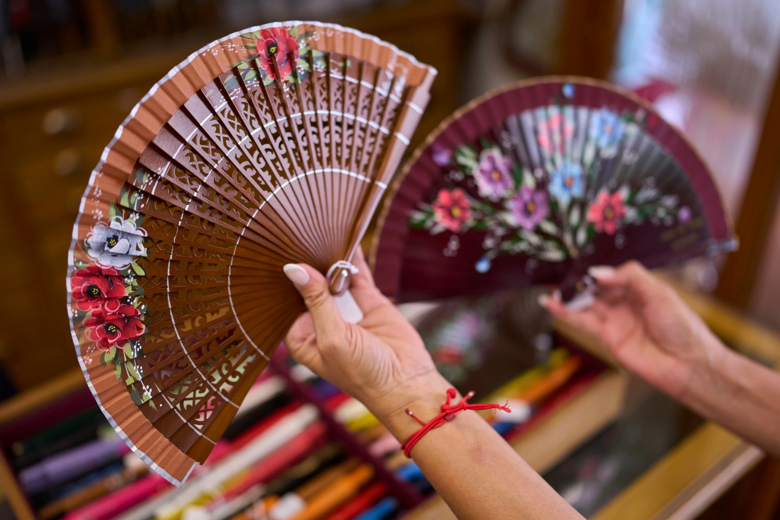 In a scorching Spain, the traditional folding hand fan is having a moment