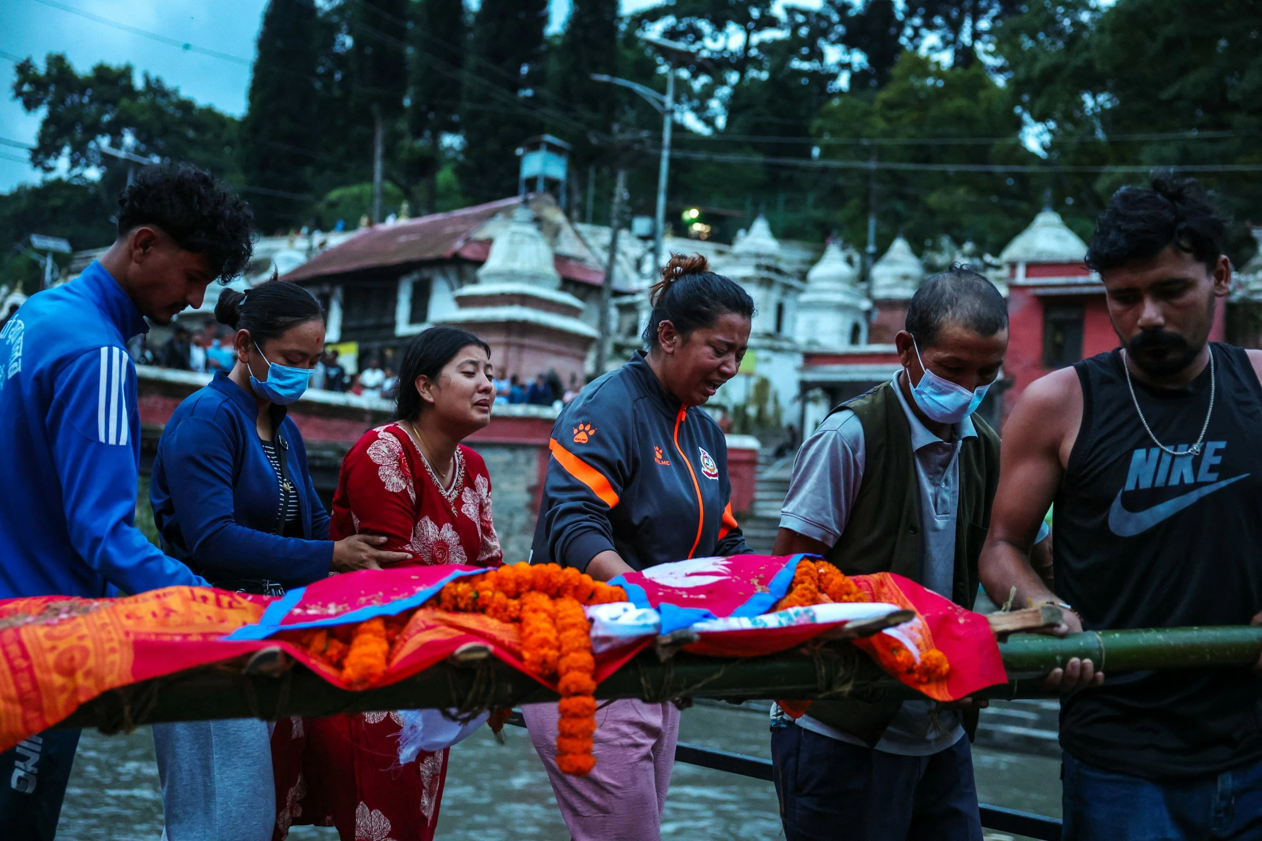 Nepal flood survivors cling to zipline to cross treacherous river