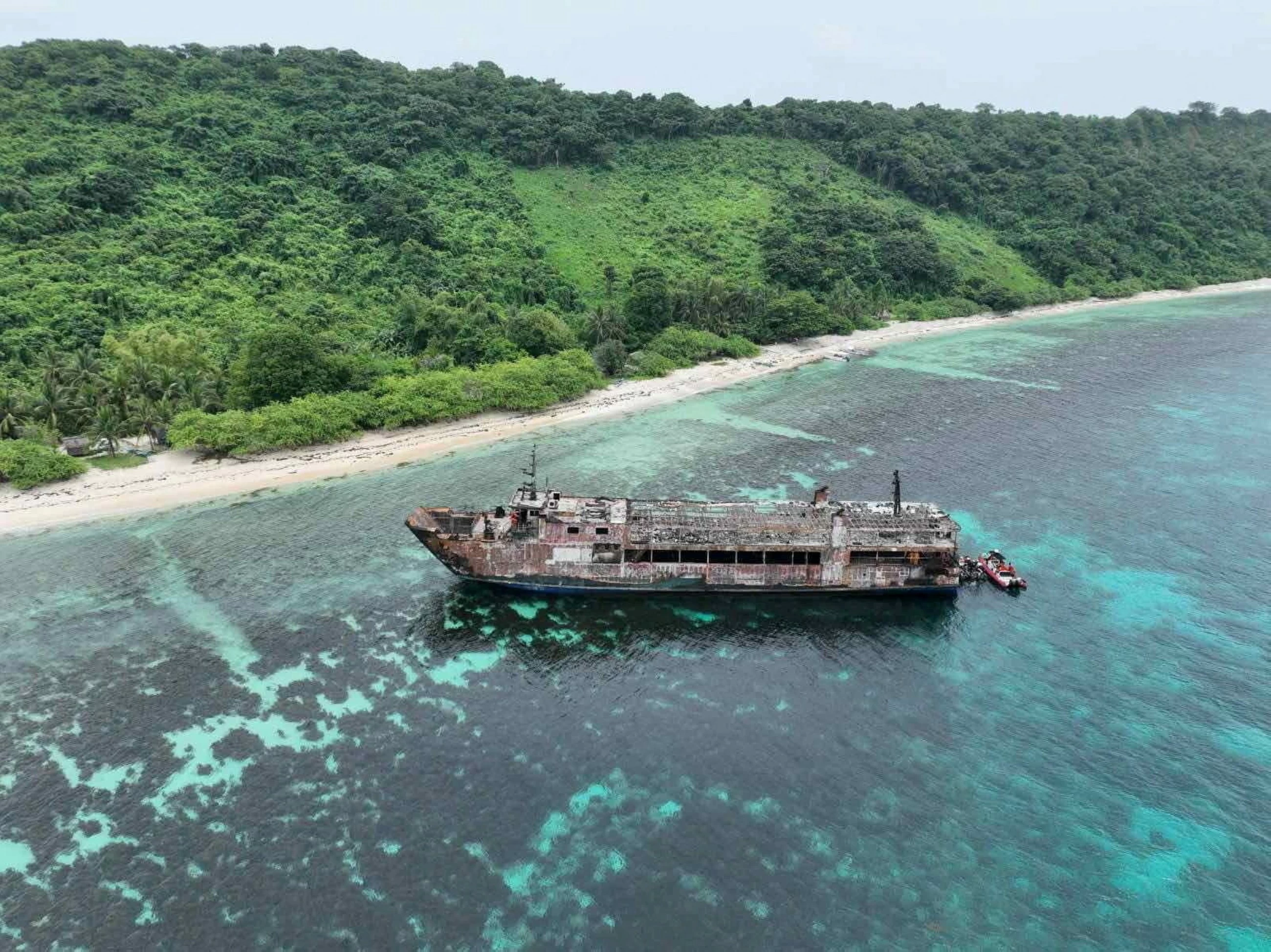 Philippine rescuers find charred remains aboard burned-out ferry