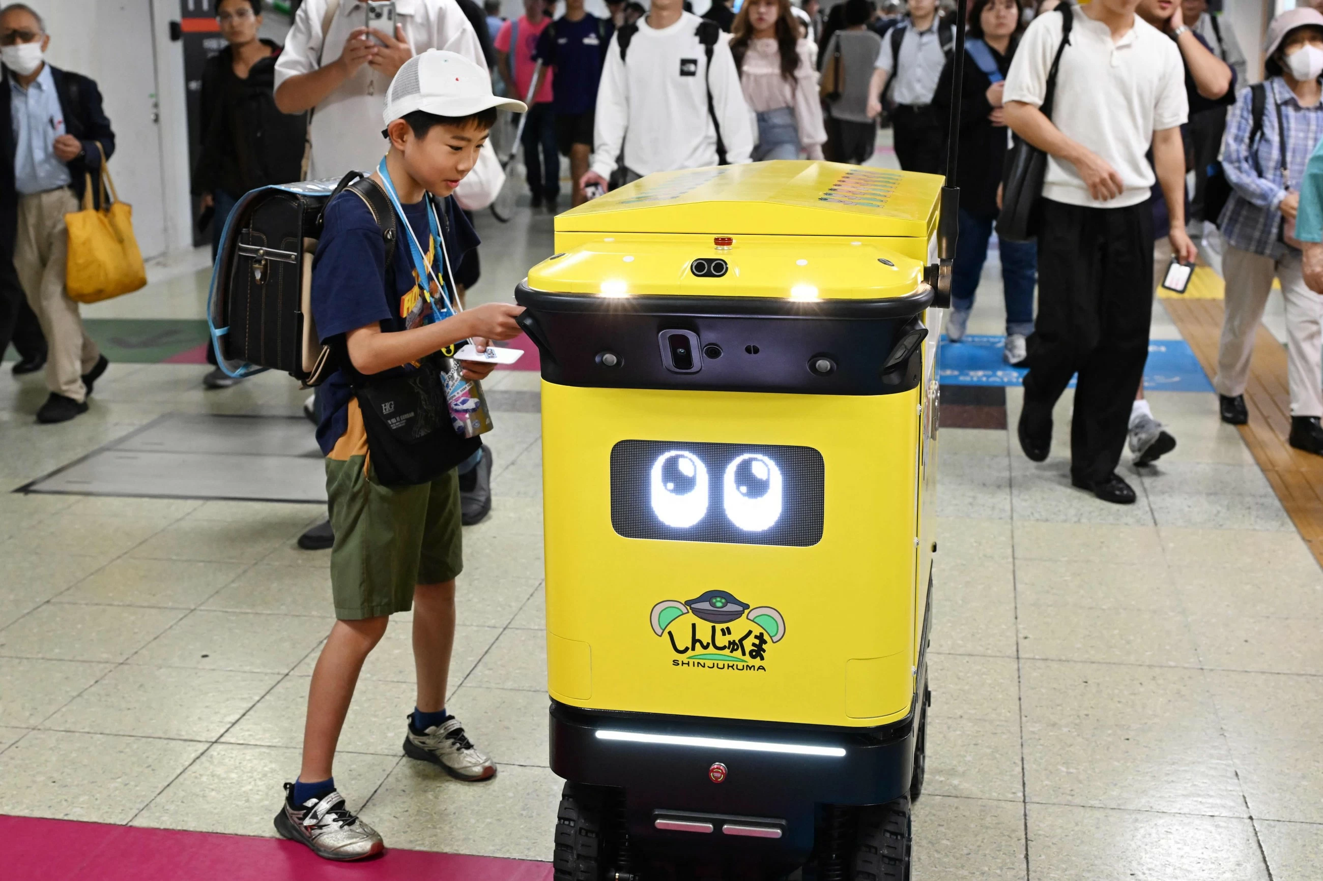 Japan's busiest railway station tests robot rubbish bins