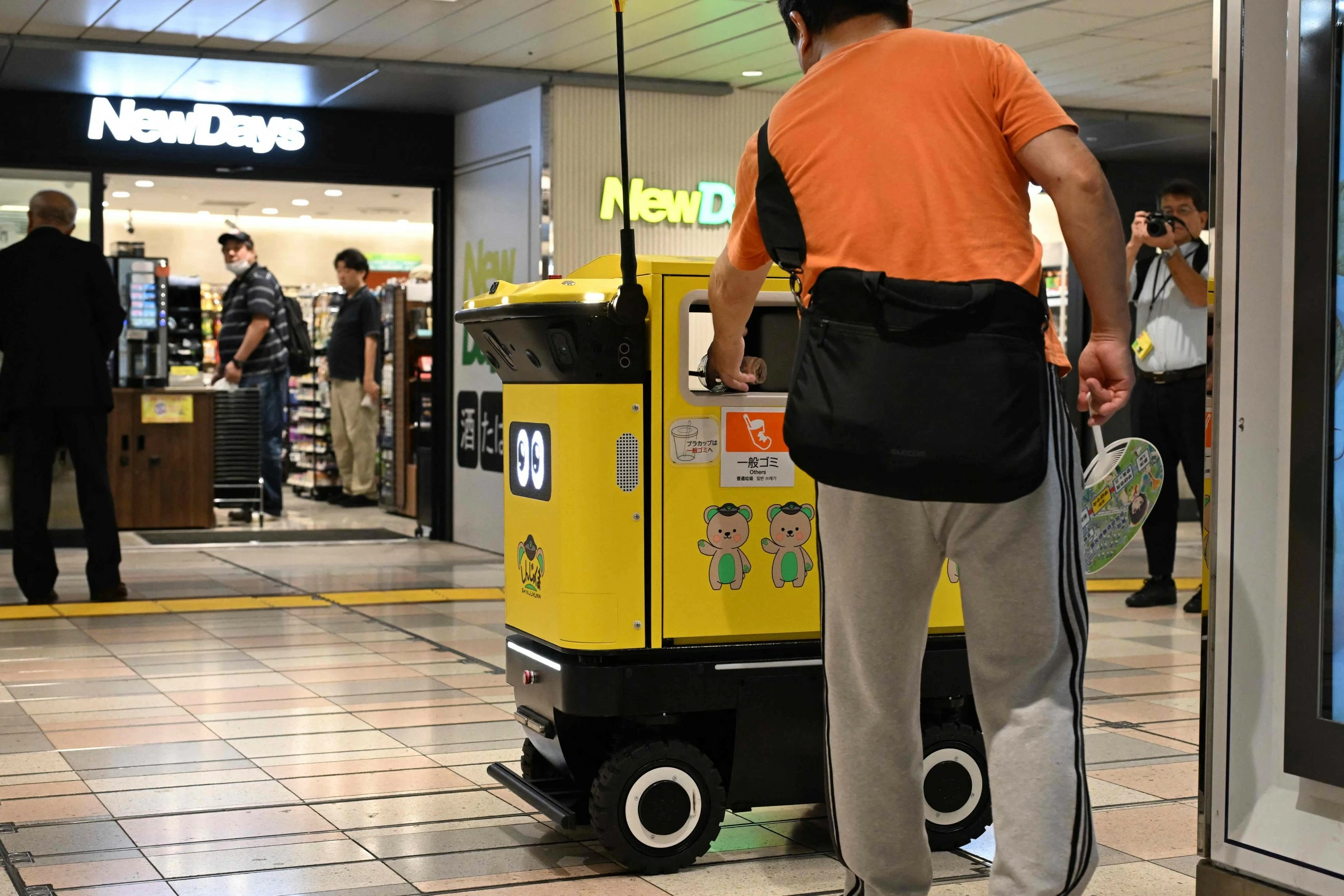 Japan's busiest railway station tests robot rubbish bins