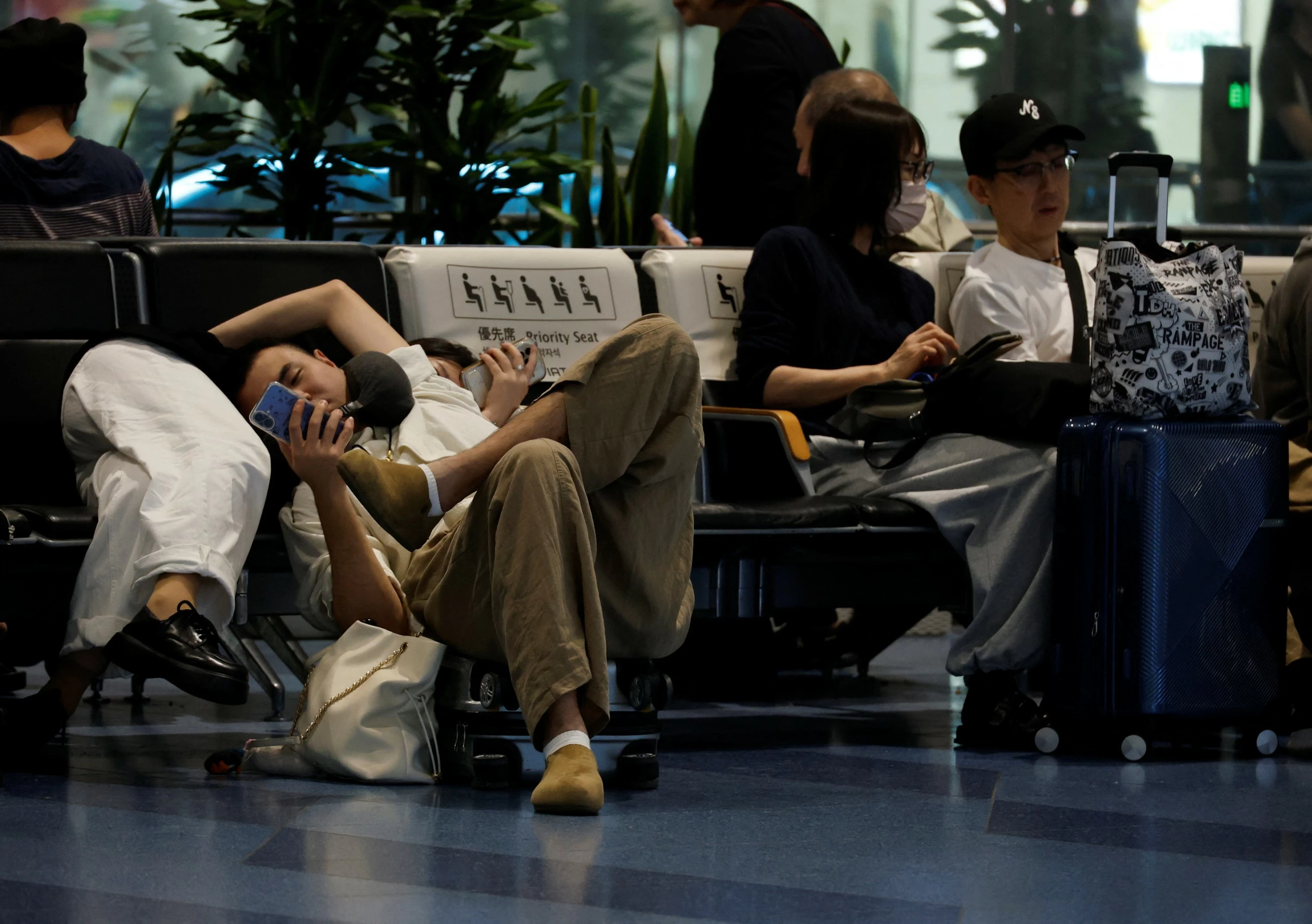 Hundreds of flights cancelled, millions told to evacuate as Typhoon Dujuan nears Japan